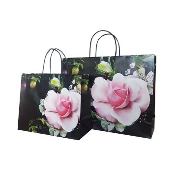 black carrier bag with pink flower